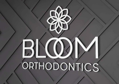 Bloom Orthodontics dimensional acrylic brand decor sign Centennial CO