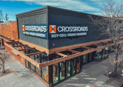 Crossroads Clothing outdoor illuminated channel letter sign on staging backer panel Denver CO