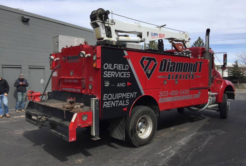 Full vehicle wrap on a commercial service truck for Diamond T Services in Golden, Colorado — custom fleet graphics installed by Vision Visual Signs