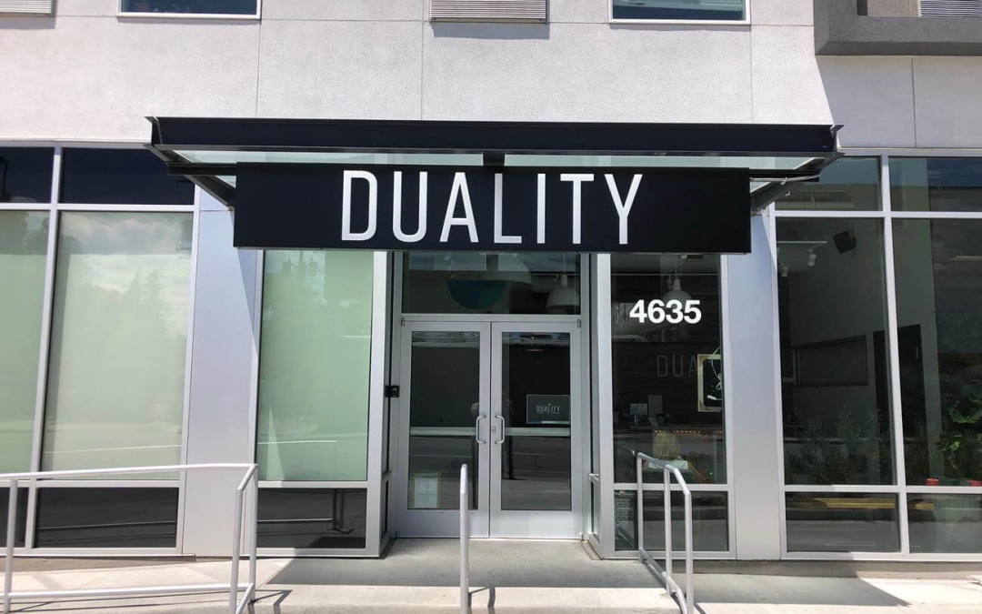 Duality-Illuminated-push-through-acrylic-arcade-sign-cabinet-storefront-Denver-CO.webp
