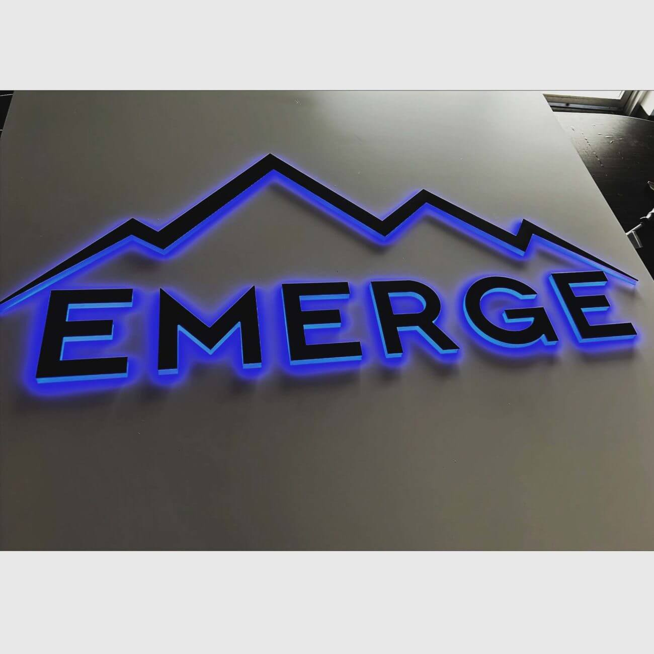Emerge exterior illuminated RGB LED sign with push through acrylic logo color purple - Denver,CO