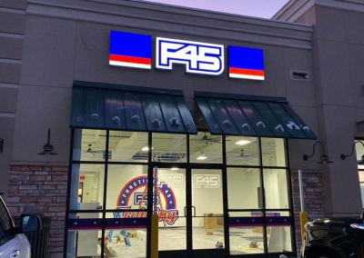 F45 LED illuminated outdoor channel letter sign night view Centennial CO