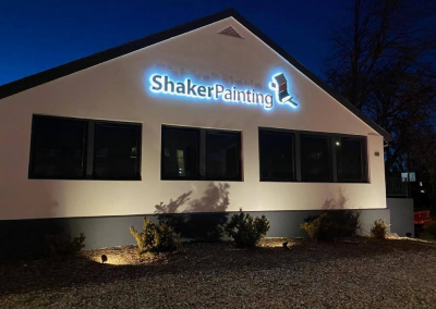 Shaker Painting halo illuminated outdoor sign night view Denver CO