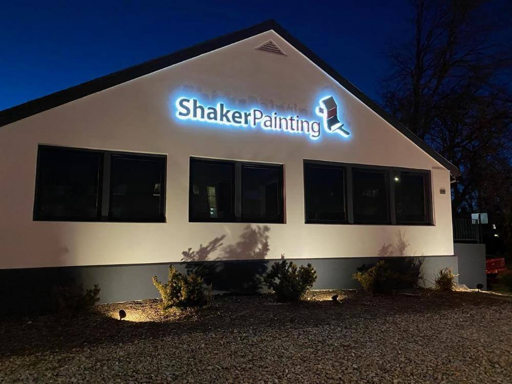 Shaker Painting halo illuminated outdoor sign night view Denver CO
