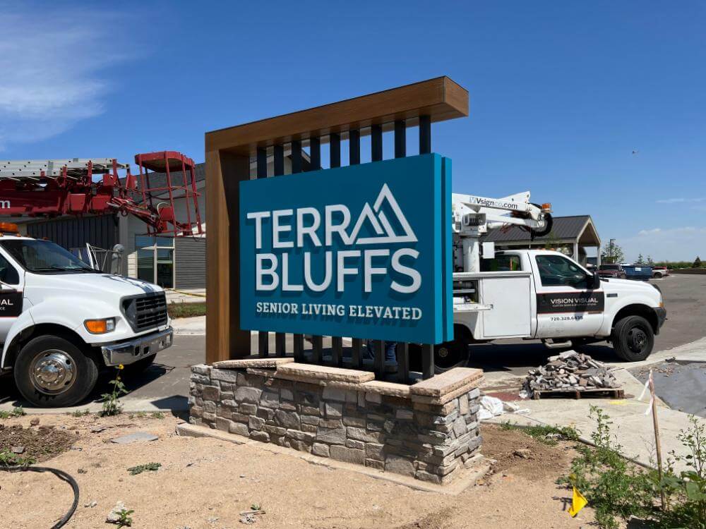 Custom outdoor monument ground sign at a commercial property entrance, Parker CO