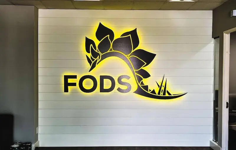 Illuminated LED lobby sign inside Denver commercial office