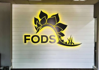 Illuminated LED lobby sign inside Denver commercial office