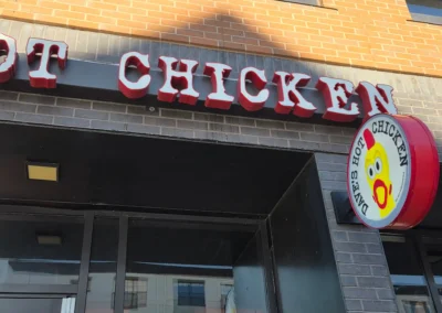 Illuminated channel letter sign for Dave's Hot Chicken in Denver, CO — custom face-lit channel letters installed by Vision Visual Signs