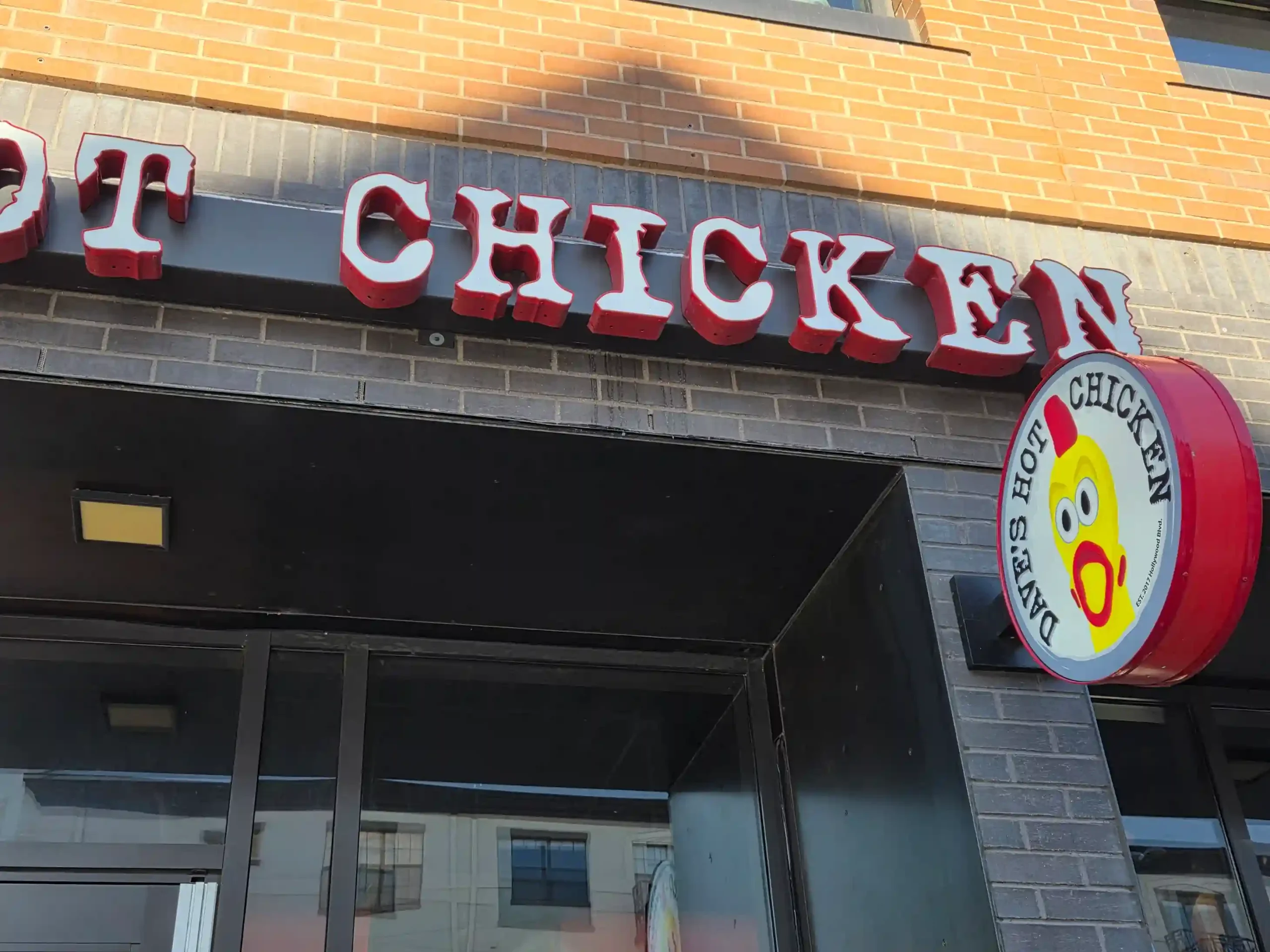 Illuminated channel letter sign for Dave's Hot Chicken in Denver, CO — custom face-lit channel letters installed by Vision Visual Signs