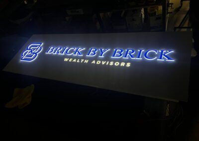 Indoor Sign Brick by Brick illuminated